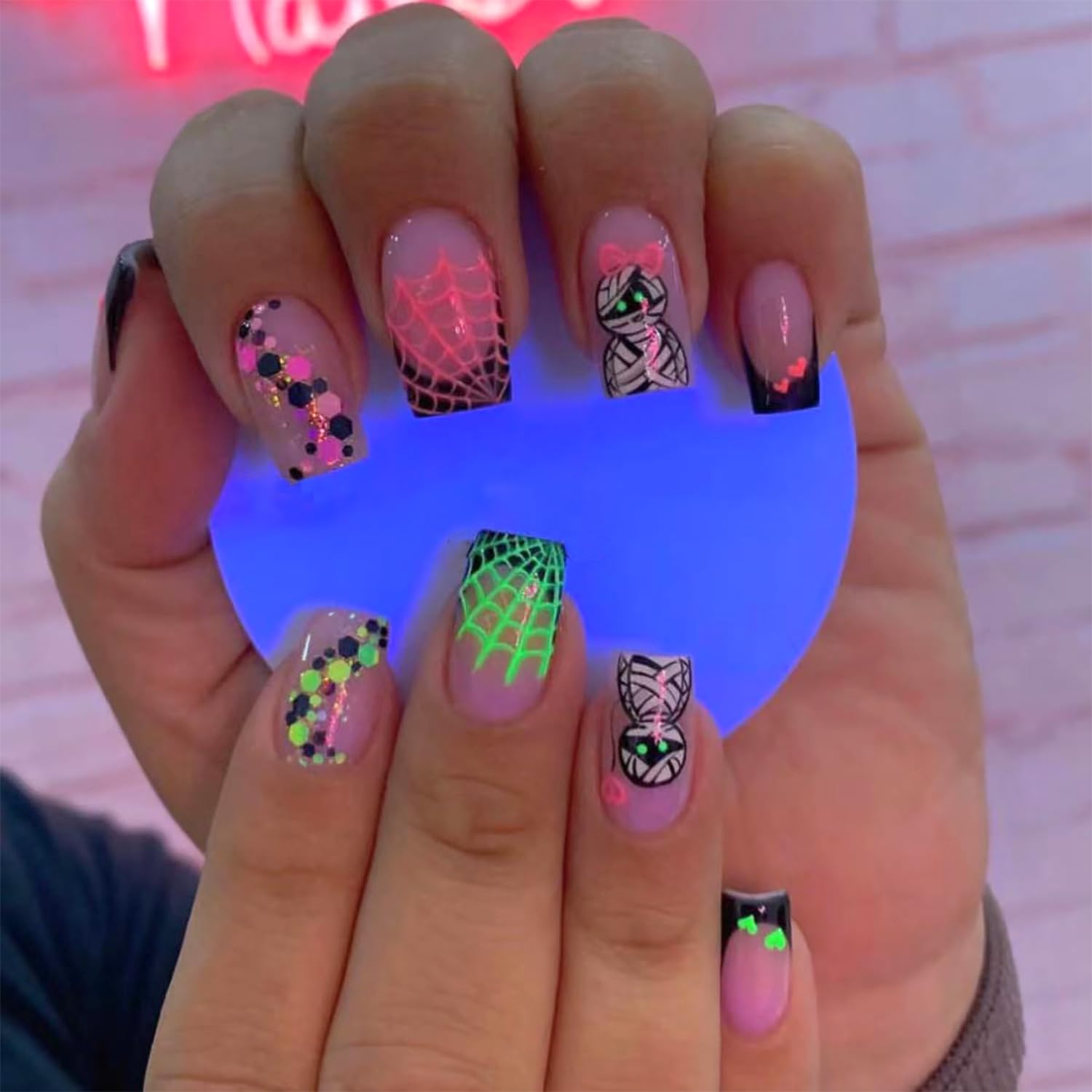 24 Pcs Halloween Press on Nails - Medium Square Fake Nails with Glow in Dark & Glitter Designs (Spider Web, Mummy) - Pink Glossy Full Cover Artificial Nails for Women - Perfect for Halloween Parties, Cosplay & Nail Art Enthusiasts