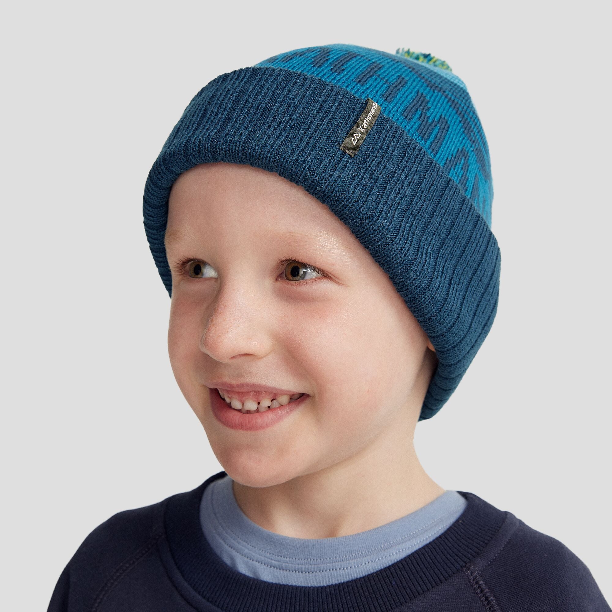 MTN Skies Kids Pompom Beanie - Dark Eddy - Warm Winter Hat for Boys & Girls - Perfect for Snow Play, Skiing & Outdoor Activities