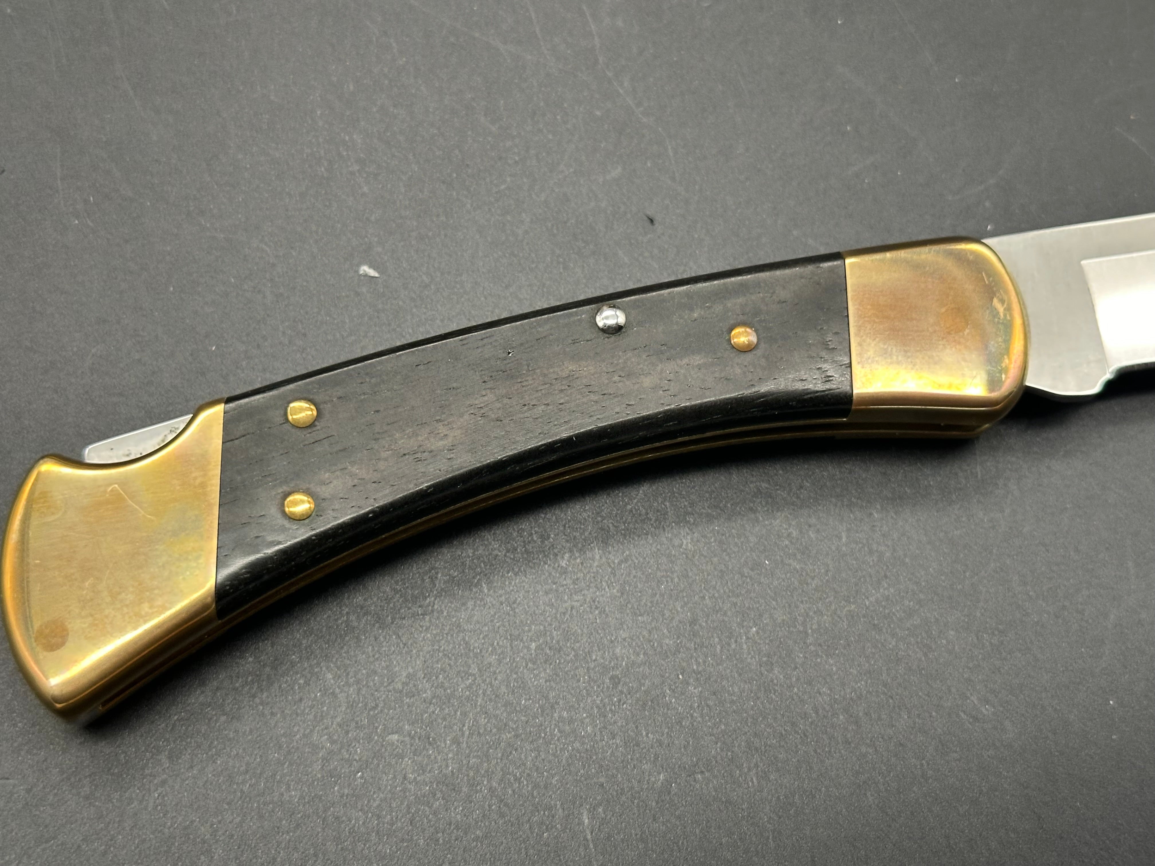 Buck 110 Automatic Folding Knife - Ebony Wood & Brass Handle, 420HC Stainless Steel Blade with Leather Sheath - Perfect for Hunting, Camping & Everyday Carry (EDC)