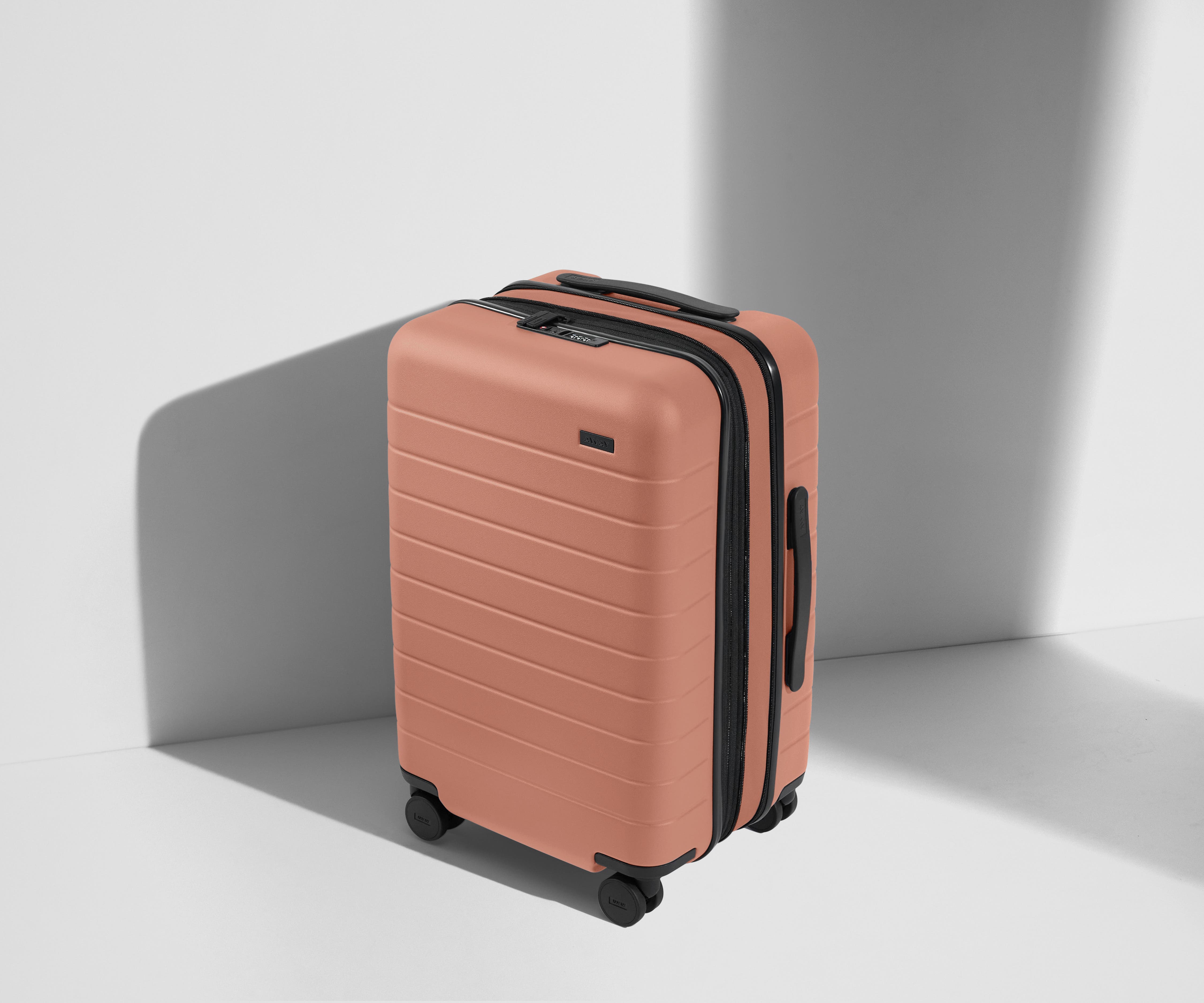 The Carry On Flex in Clay Pink - Lightweight Expandable Luggage for Travel, Business Trips & Weekend Getaways