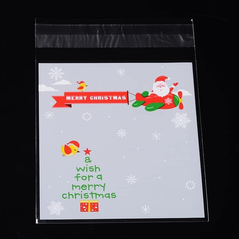 100Pcs Christmas Rectangle Cellophane Bags - Flying Santa Claus & Tree Pattern OPP Plastic Bags with Self-Adhesive Seal for Holiday Snacks, Candy, Cookies | Perfect for Gift Wrapping, Dessert Storage & Party Favors | Great for Christmas Parties, Baking Treats & DIY Gift Packaging